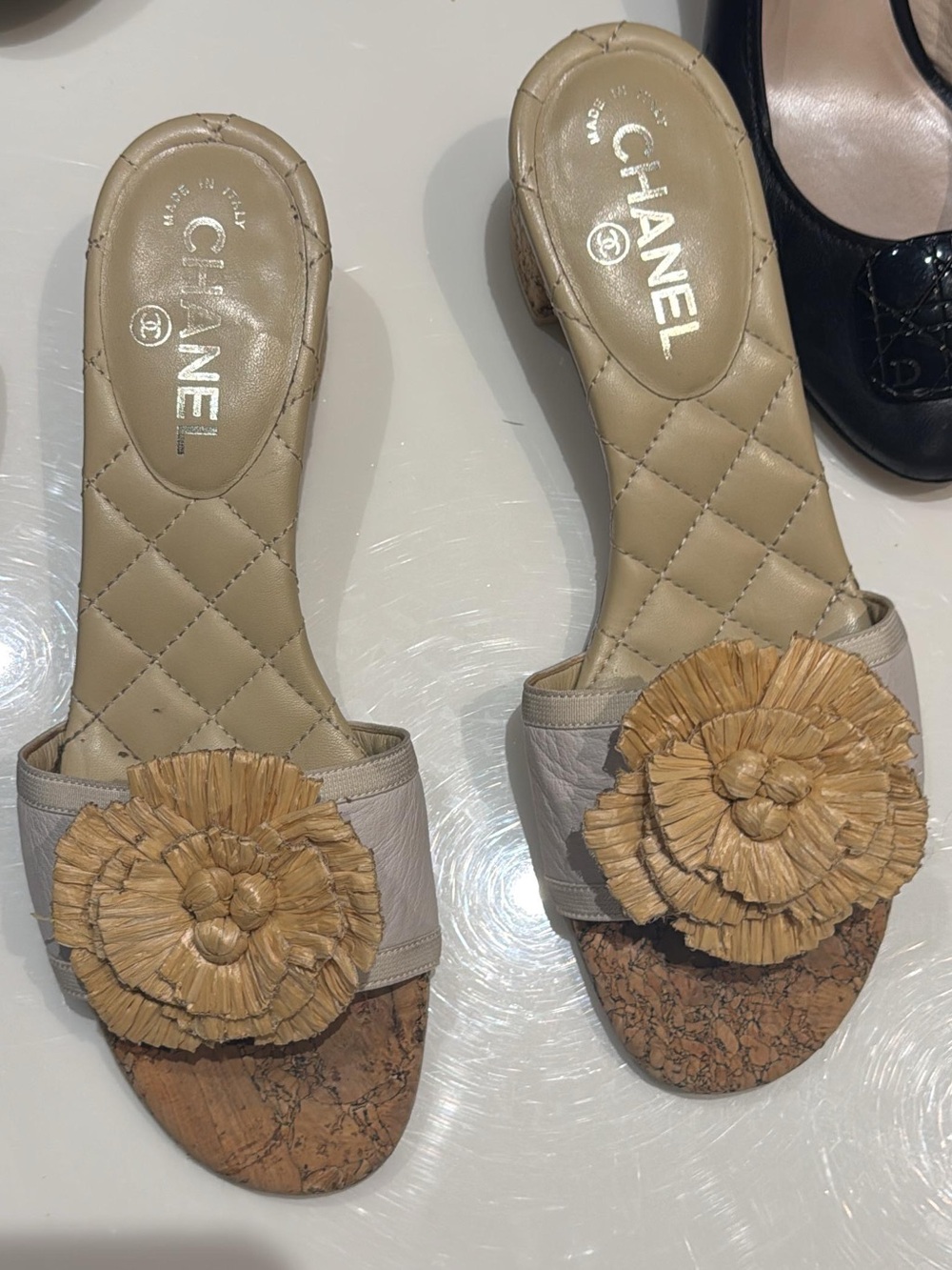 CHANEL Quilted Beige Slide Mules with Raffia Floral Appliqué